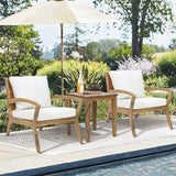 two-chairs-and-a-table-by-a-pool
