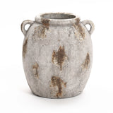 A weathered, gray ceramic pot with rust-like spots and two side handles exudes a handcrafted, vintage appeal reminiscent of an old terracotta jug vase.