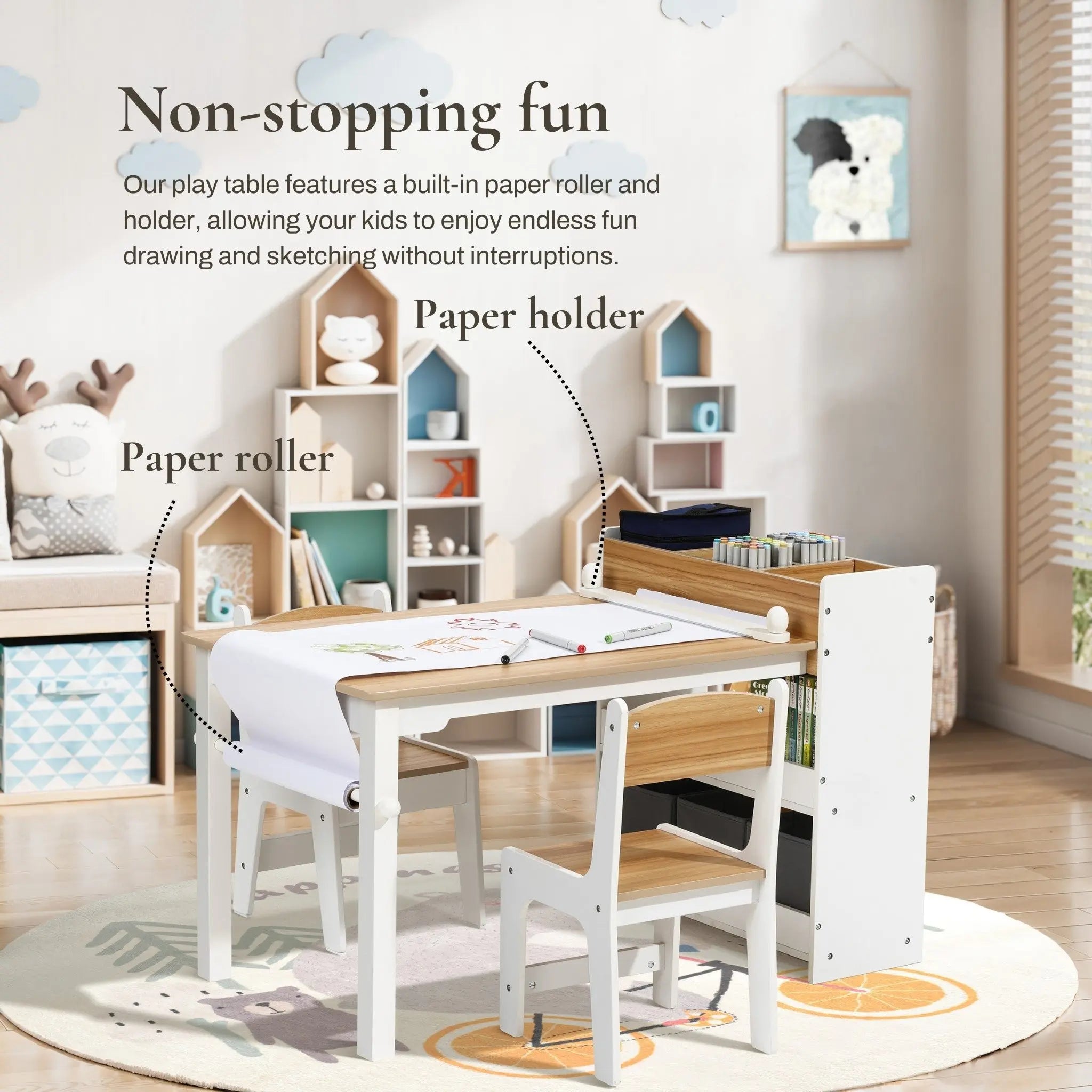 A childrens playroom features the LuxenHome Children Play Table with Bookcase and 2 Chairs Set. Nearby are wooden storage units with paper rolls and assorted art supplies. Sunlight filters through a large window, creating a bright, inviting atmosphere for creativity.