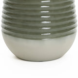 Close-up of a textured, cylindrical ceramic vase with a ribbed upper half and smooth lower half, in shades of green and white. Perfect as an elegant planter, it seamlessly complements both indoor and outdoor environments.