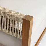 Close-up of a Rope Sides Loveseat corner, showcasing an outdoor Acacia wood frame with tightly-woven beige rope detailing and a light-colored cushion.