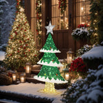 A festive outdoor scene with LED-lit Christmas trees and lanterns, surrounded by snow and beautifully decorated windows, embodies the holiday decor perfectly.