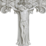 White crucifix with a detailed depiction of Jesus on the cross, emblematic of the Christian faith, featuring ornate decorations and a circular emblem with letters above. Perfect for religious occasions.