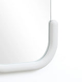 Experience modernist elegance with this decorative wall mirror, featuring a minimalist design and a C-shaped silhouette. Its curved, light gray frame adds a subtle touch against the plain white background.
