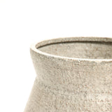Close-up of a textured, light brown ceramic vase in vintage distressed style with a wide, rounded opening against a white background; perfect for enhancing your indoor space decor.