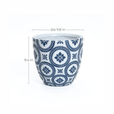 Modern planter crafted from white ceramic with blue geometric patterns, featuring a drainage hole for optimal plant health. It measures 9.8 inches in diameter and 9.4 inches in height, making it a stylish addition to any space.