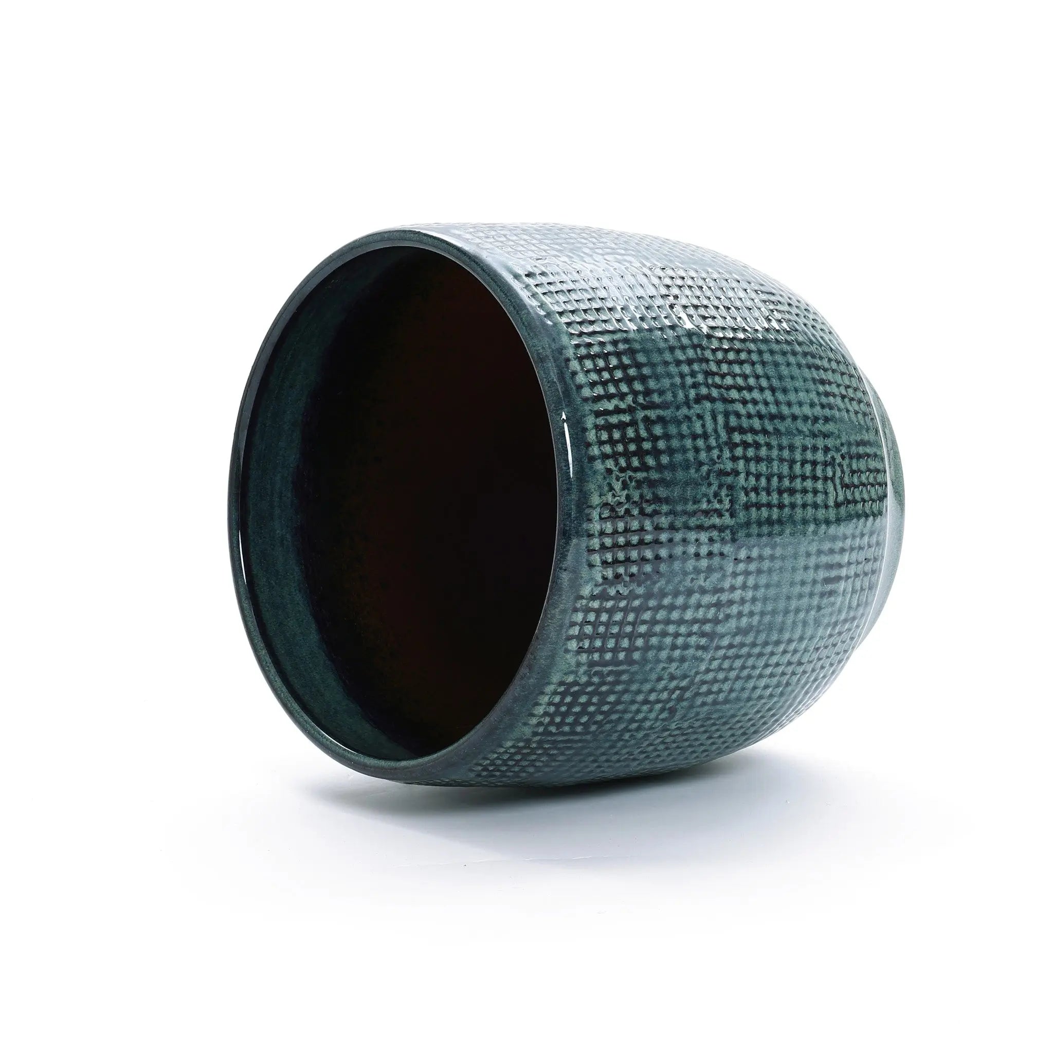 The Marina gray glazed round ceramic planter by LuxenHome, 11.22 high, showcases a textured green surface with a subtle checkered pattern and glossy finish. It lies on its side against a white background, with its opening visible, enhancing its refined elegance.