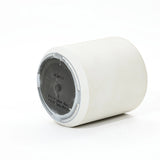 A white cylindrical planter with a gray base is shown, lying on its side. The contemporary design includes inscribed text and a notice to drill holes for durability.