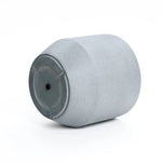 A gray, cylindrical fender with a slightly textured surface and a flat top is shown against a white background, reminiscent of a modern minimalist planter.