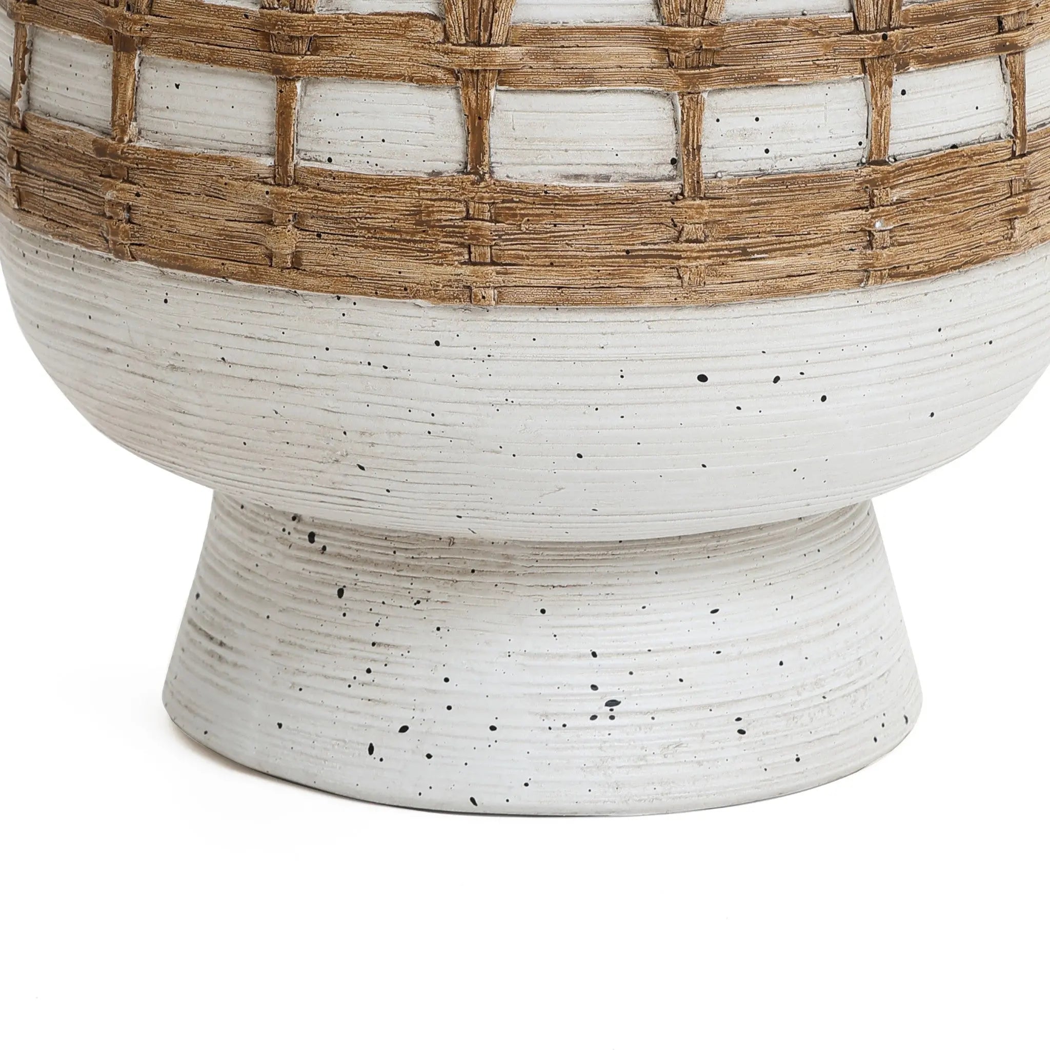A Bohemian-style ceramic vase with a wide base and speckled white surface, featuring a textured midsection with a woven basket-like design in light brown.