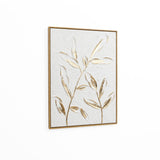 Framed artwork featuring two stylized branches with textured leaves and a subtle gold leaf motif on a neutral background, set against a plain white wall.