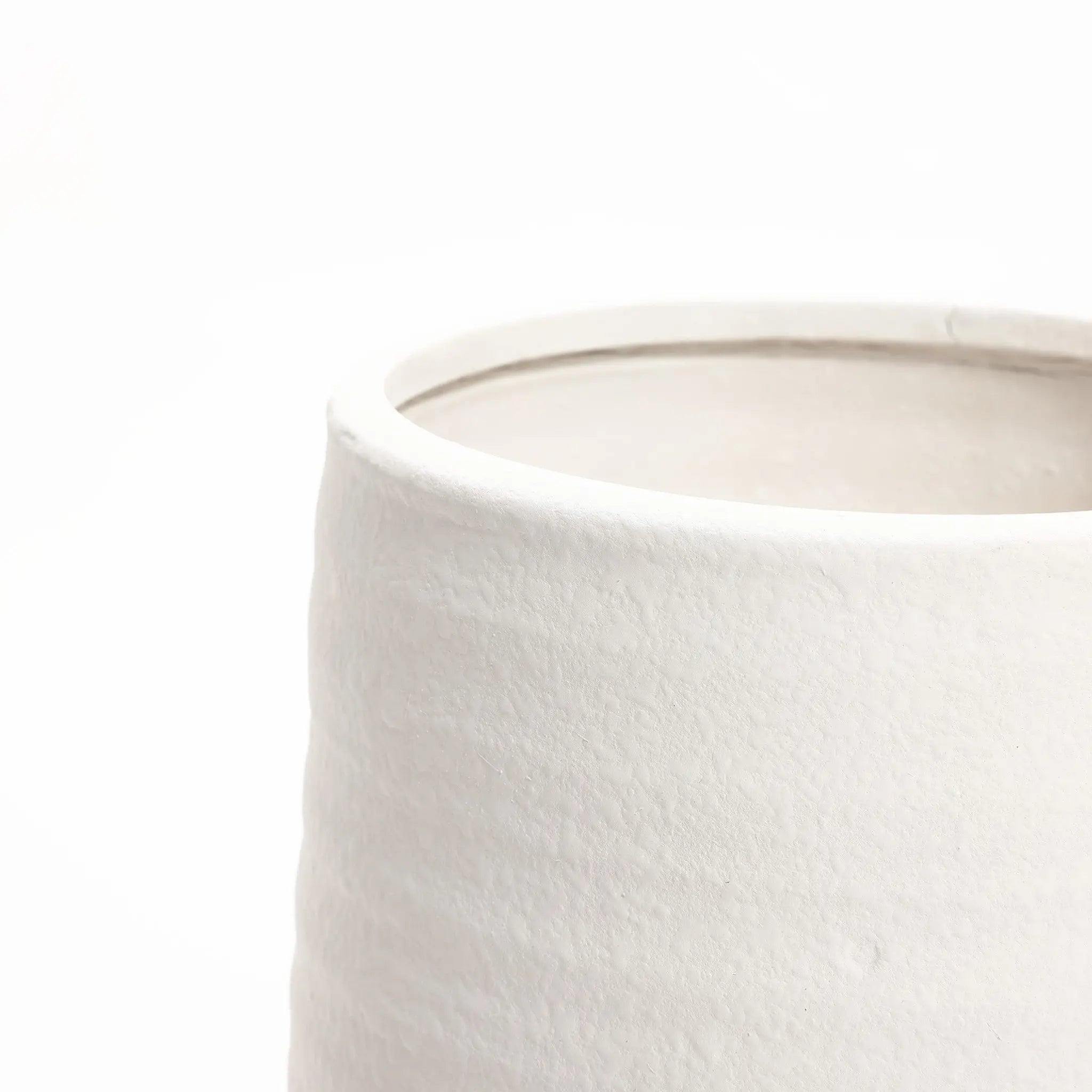 Close-up of the upper portion of a textured, white terracotta vase against a plain white background, showcasing its elegant design perfect for both indoor and outdoor settings.