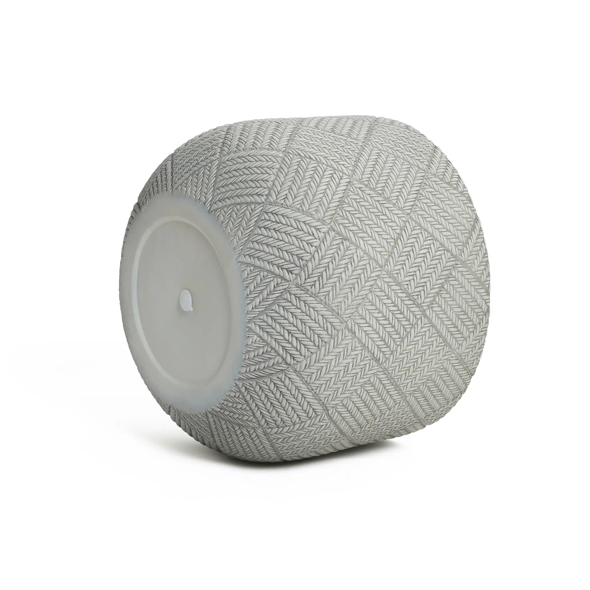 A modern, minimalist aesthetic defines this cylindrical planter, crafted from durable MgO material. Its textured, interwoven pattern and flat circular base stand elegantly against a plain white background.