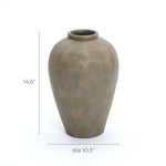 The Rustic brown terracotta urn vase by LuxenHome, standing 14.6 inches tall, brings rustic elegance to refined home decor with its textured rim and olive-green hue against a simple background.