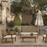 Outdoor patio featuring a minimalist design with an FSC-certified Acacia wood furniture set, including chairs, a loveseat, and a table on a rug. An umbrella, potted plants, and a stone wall with a lion head sculpture complete the serene setting.