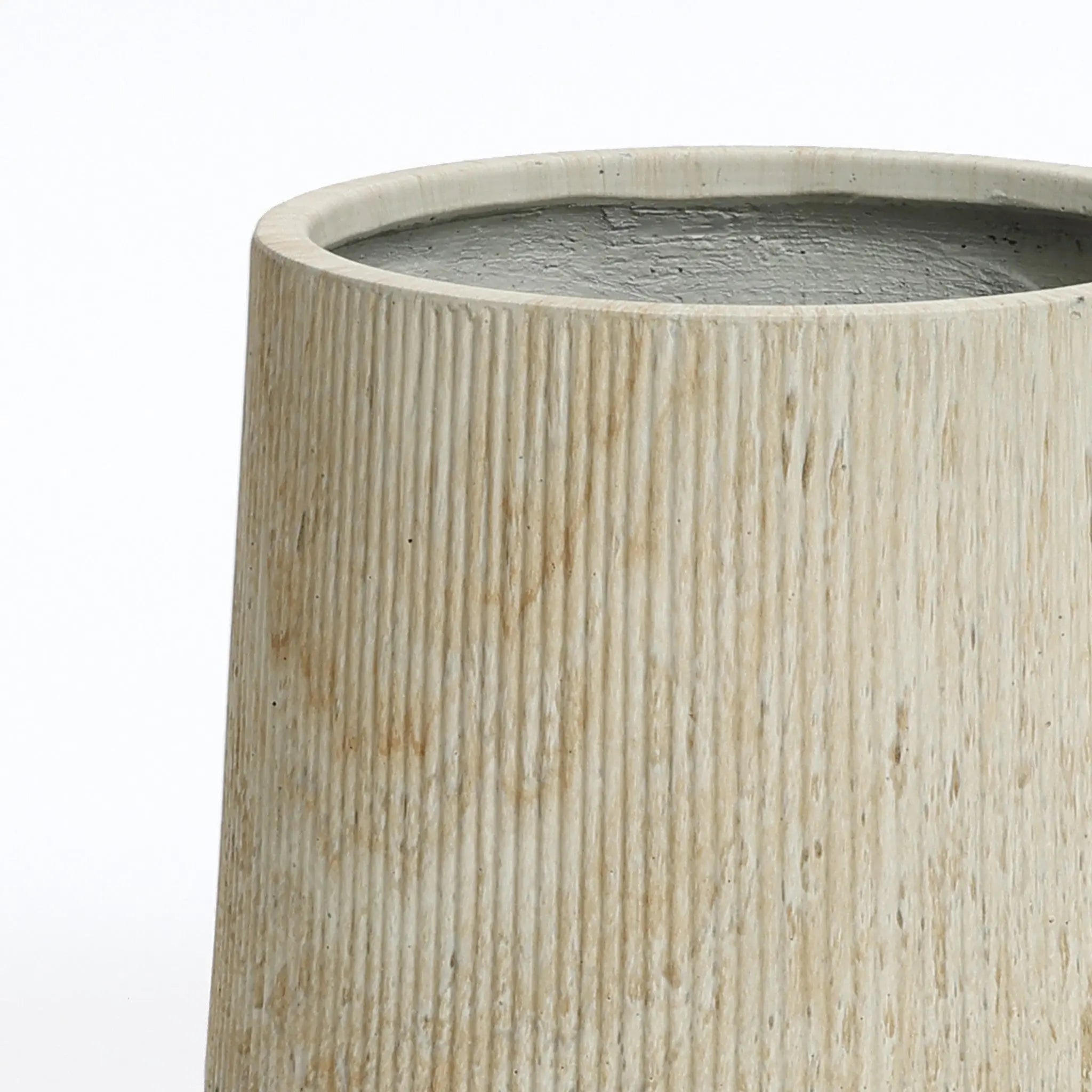 Close-up of a beige cylindrical vase with a textured, ribbed surface, perfect for creating an elegant succulent garden display.
