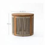 This drum-shaped round end table features a wooden top crafted from natural acacia wood and sides adorned with hand-woven rope. Its dimensions are 17.6 inches high and 18.9 inches in diameter, making it a versatile addition to any room.
