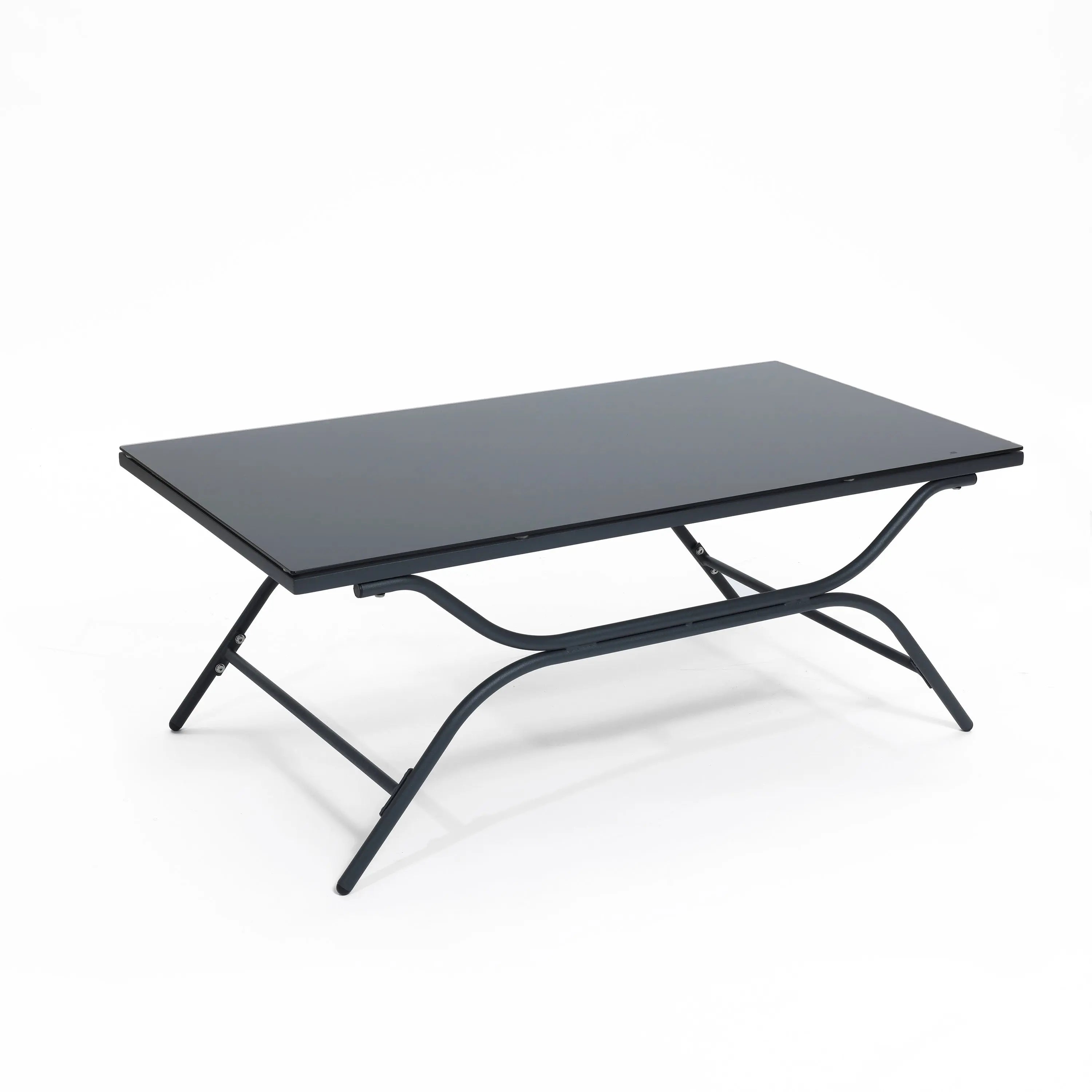 A black rectangular folding table with a metal frame and flat top is elegantly paired with an outdoor seating set, creating a sleek contrast against the plain white background.