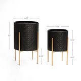 Two elegant planters with gold metal stands feature a textured pattern. The larger planter is 15 tall and 14.12 wide, while the smaller one is 11.12 tall and 11.56 wide, making them a stylish addition to any space.