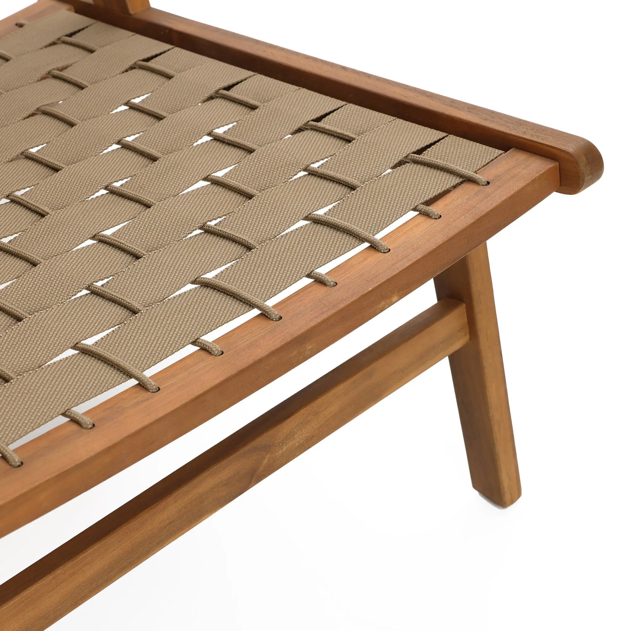 Close-up of a woven chair with a beige seat made from interlaced straps. Crafted from acacia wood, this simple, angled piece boasts a natural finish, making it ideal for outdoor furniture settings.