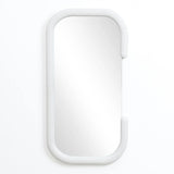 This decorative wall mirror features a modernist elegance with its rectangular form and rounded edges, all gracefully set within a sleek white oval frame, mounted on a plain white wall.