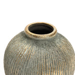 A close-up of the Rustic Gold and Brown Terracotta Bud Vase by LuxenHome highlights its round, textured design, narrow opening, and vertical ridges. The vases antique distressed look is accentuated by a mottled gray and bronze finish against a plain white background, ideal for this unique home decor piece.