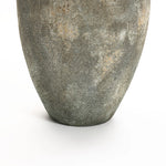 A close-up of the lower half of LuxenHomes Rustic gold and brown terracotta urn vase, 15.2 h, features a textured, aged pattern. It elegantly adorns any home decor on a simple white surface.