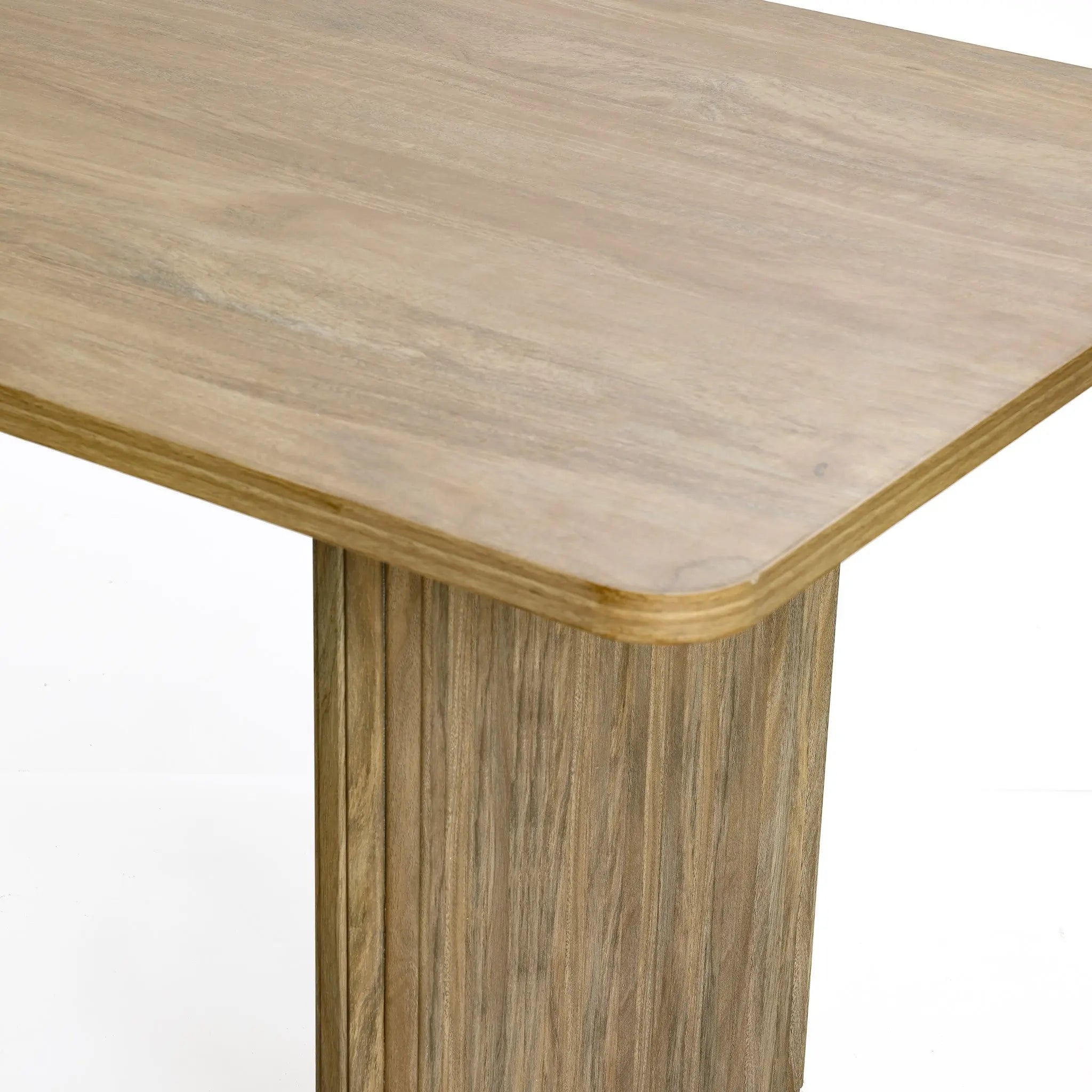 The LuxenHome Aria dining table, with smooth edges and a 63 wide tabletop, features a light wood grain finish that highlights its natural texture. Perfect for various decor styles, this rectangle table is ideal for 6 people and shown against a plain white backdrop.