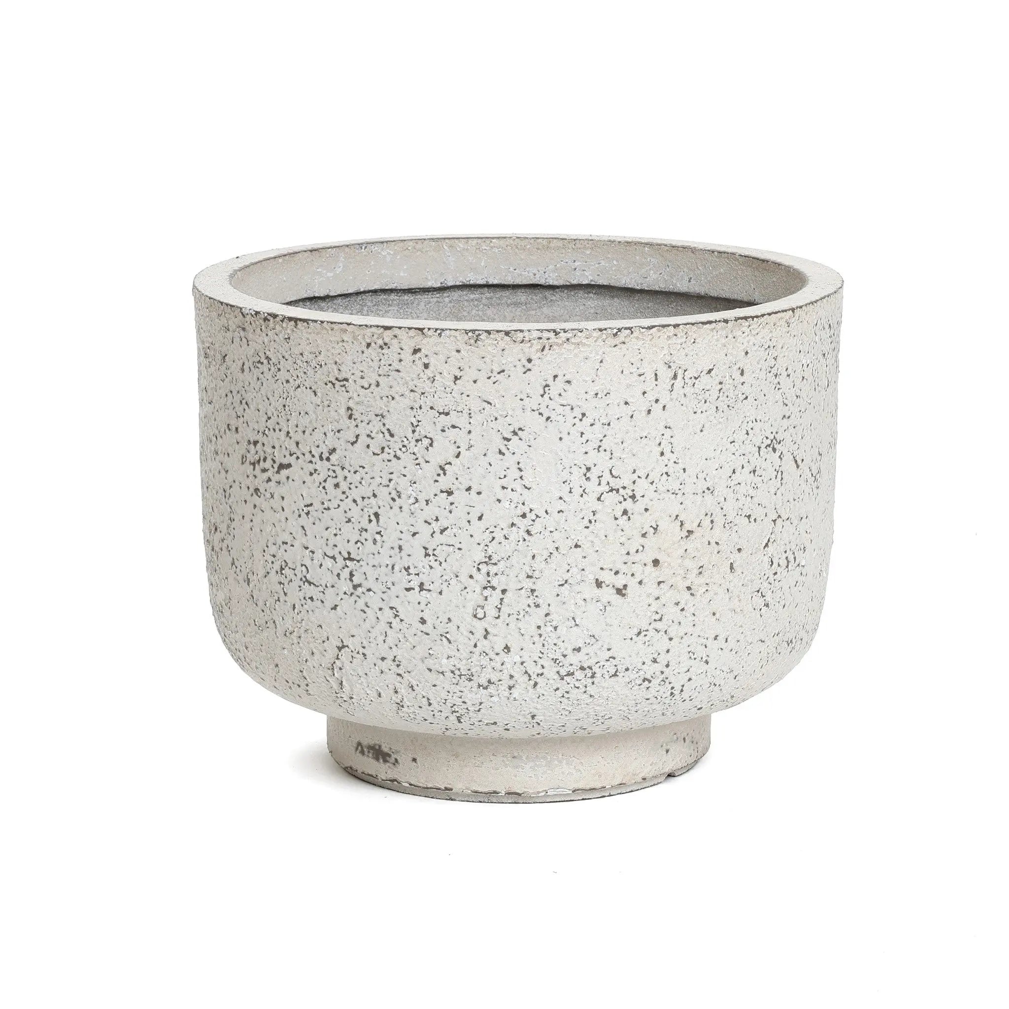 A round, speckled beige ceramic planter with a wide rim and short base exudes retro minimalist decor against a white background.