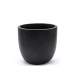 A plain, round, matte black contemporary planter with a wide opening, set against a white background.