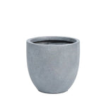 A plain, round, gray cement planter pot with a smooth surface and a contemporary planter style, set against a white background.