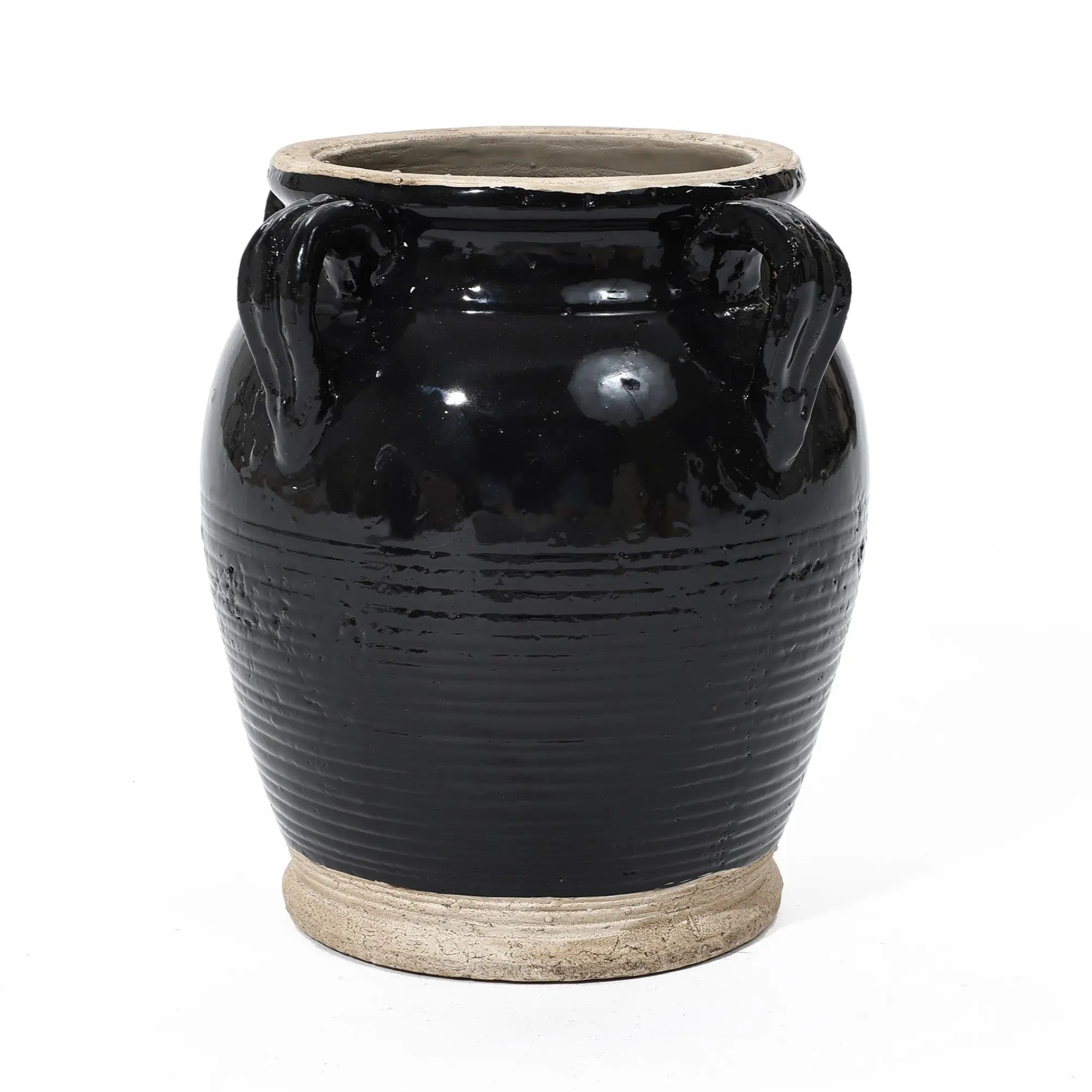 Black ceramic vase with two loop handles, a beige rim and base, showcasing an exquisite black glaze against a white background.