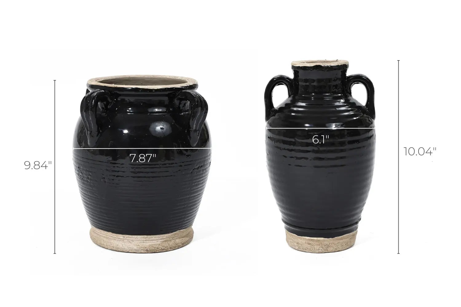 Two black ceramic jugs with handles, showcasing a glossy black glaze. The left jug is 9.84 tall and 7.87 wide, while the right one stands at 10.04 tall and 6.1 wide. Both boast a handcrafted appeal with a beige base that perfectly complements their elegant finish.