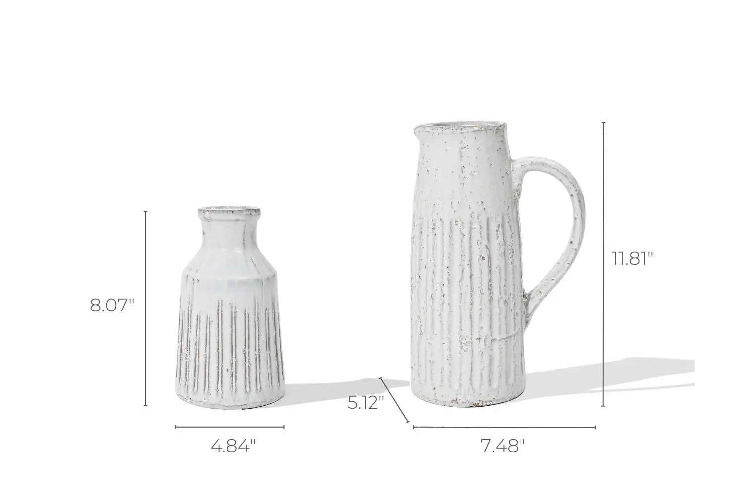 The ceramic vases evoke rustic charm with their textured finishes, reminiscent of vintage design. One resembles a milk jug table vase at 8.07 high and 4.84 wide, while the taller piece features a handle, standing at 11.81 high and 7.48 wide.