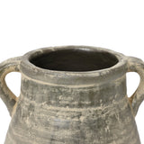This handcrafted gray ceramic jug, featuring two handles and a weathered finish, exudes historic depth reminiscent of ancient terracotta vases.