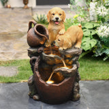 Adorable-two-puppies-trying-to-drink-water-with-led-lights-outdoor-fountain
