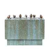 Rectangular green outdoor fountain with six small bronze bird sculptures perched on the edge and flowing water streams emerging from the top—perfect for any patio or garden.