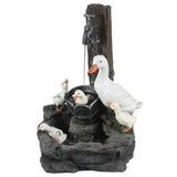 A decorative resin water fountain featuring a white duck and four ducklings around a stone basin, with water flowing from a faucet above—perfect for brightening your outdoor space.
