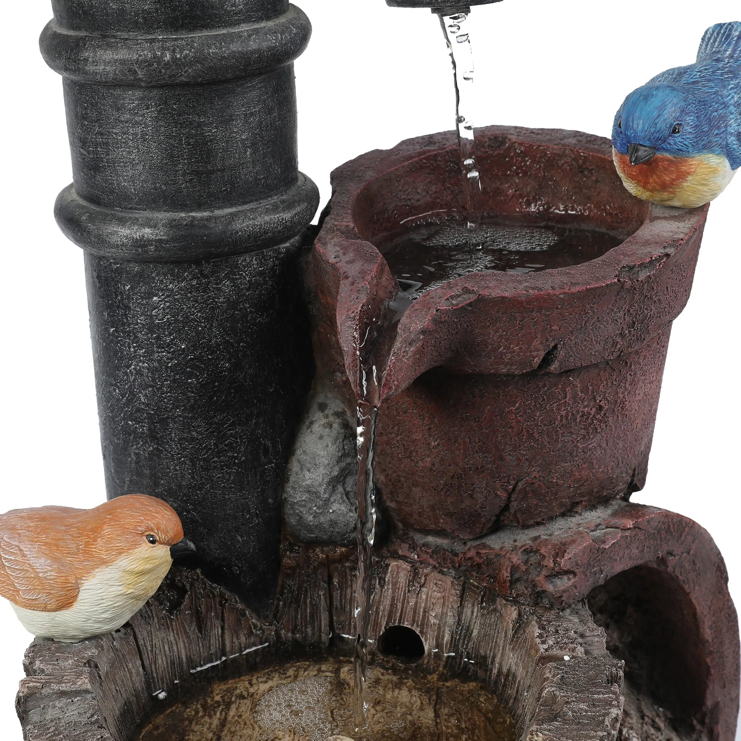 A close-up of a farmhouse outdoor fountain with two artificial birds perched on stone-like structures, water flowing gently through small basins, adding rustic charm to any space.