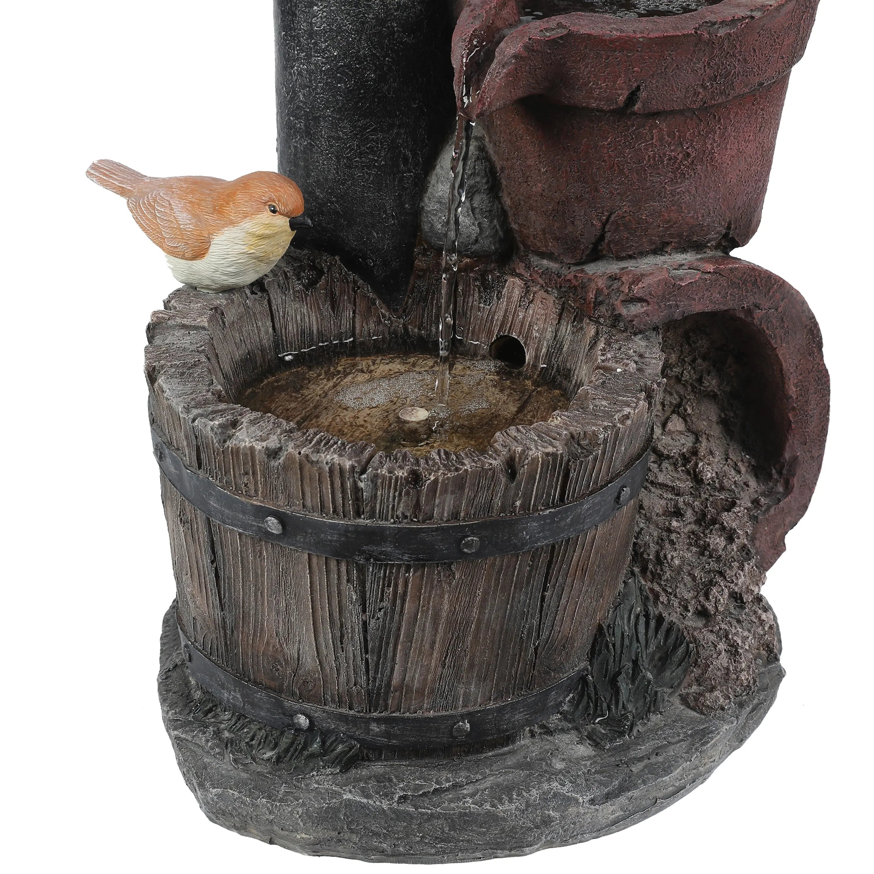 A small bird figurine sits on the rim of a rustic wooden bucket, with water trickling in from an upper spout, adding vintage farmhouse décor and rustic charm to any space.