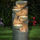column shaped garden fountain with glowing lights in the bowls