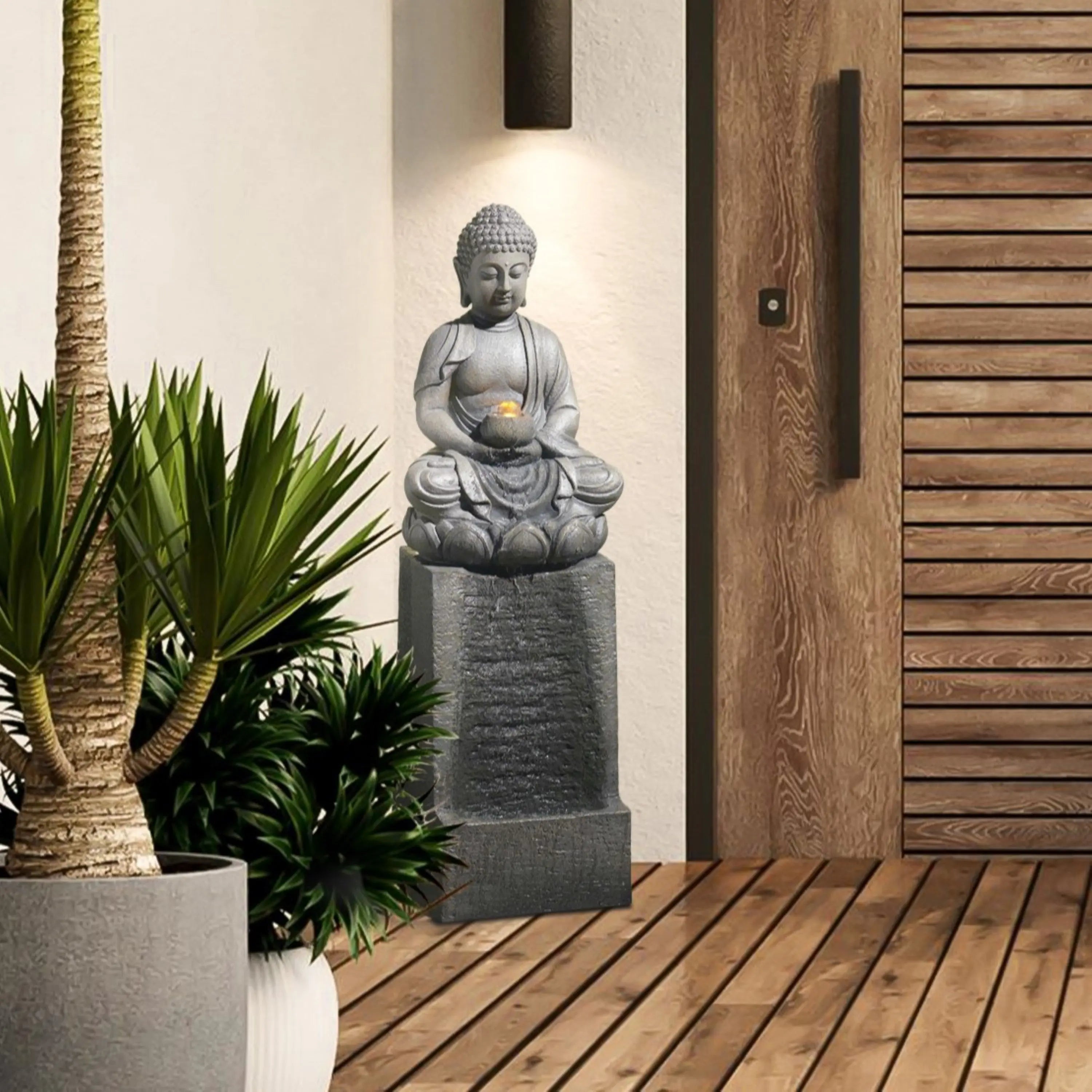 Buddha-statue-and-a-potted-plant-on-a-wooden-deck