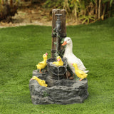outdoor-fountain-with-a-family-of-ducks-bathing-at-farmhouse-style-water-pump