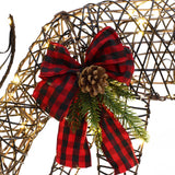 A decorative rattan deer figure made of metal and lights, adorned with a red and black plaid bow, pine cone, and evergreen sprigs—perfect as LED Holiday Decor for your festive display.
