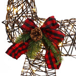 A close-up of a decorative reindeer frame with LED lights, featuring a red and black plaid bow, pinecone, and evergreen sprigs—perfect as a charming holiday decoration.