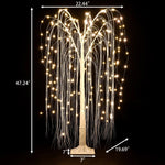 Romantic willow tree with hanging branches, pre-lit by delicate LED lights. Shown against a black background with labeled dimensions: 47.24 tall, 22.44 wide, 19.69 branch spread, and 7 base.