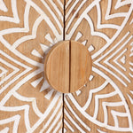 Close-up of a round wooden cabinet knob on accent cabinet doors, featuring a natural wood finish with white geometric patterns and intricate floral scroll work.