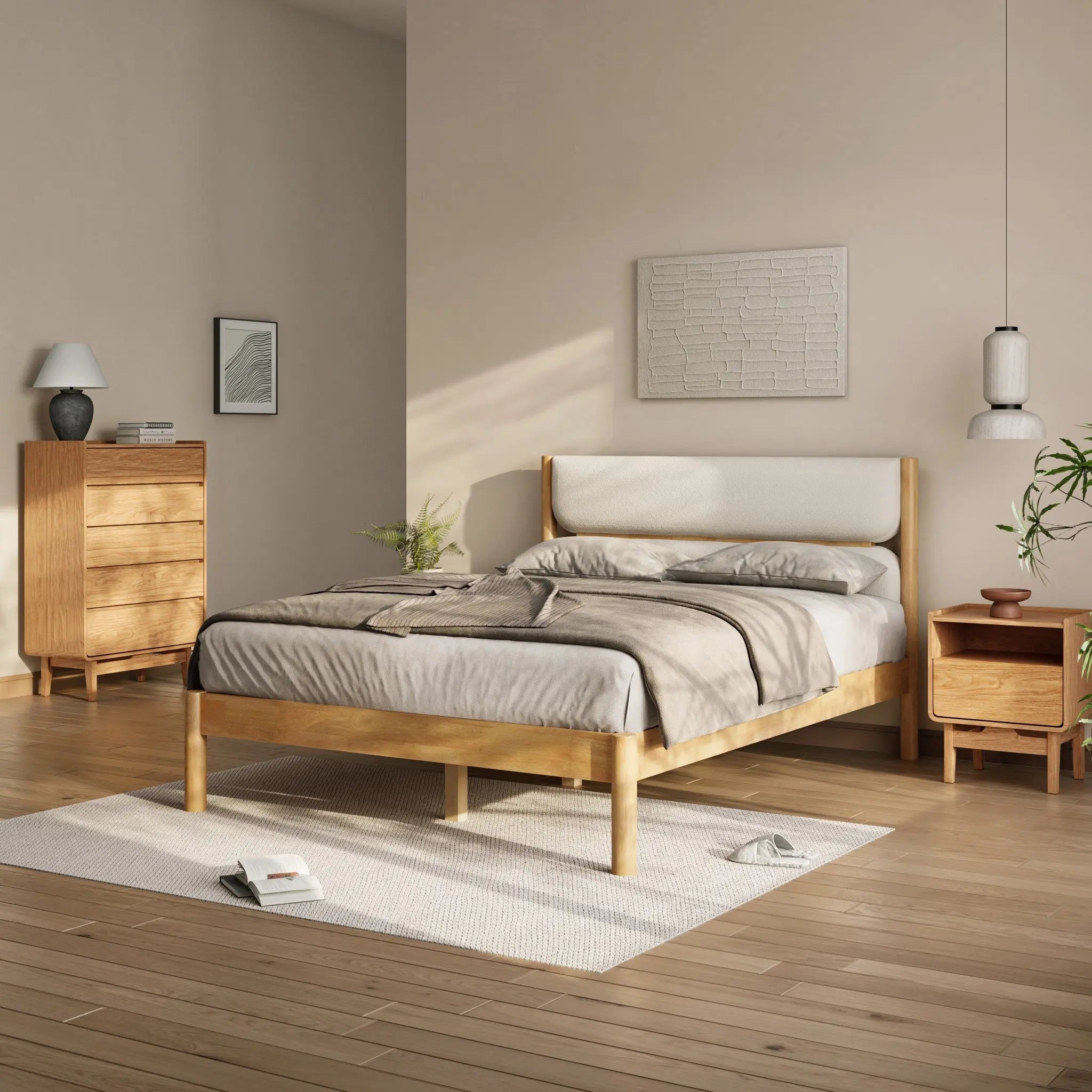 A minimalist bedroom featuring a solid wood bed frame with light gray bedding and a matching dresser exudes modern sophistication. A small rug, plants, and simple wall decor complete the serene setting with a touch of luxurious white boucle fabric.