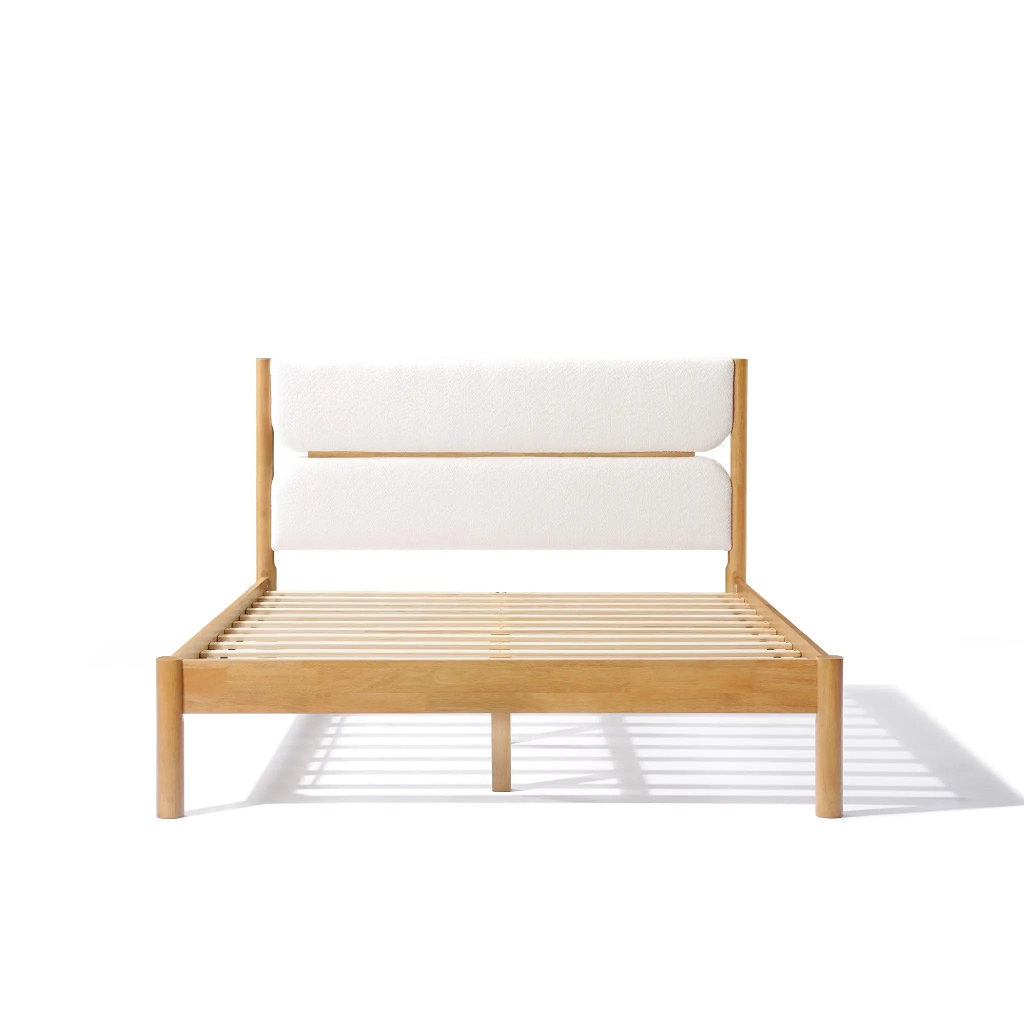 Solid wood bed frame with a luxurious white boucle fabric cushioned headboard, showcased against a pristine white backdrop, exuding modern sophistication.