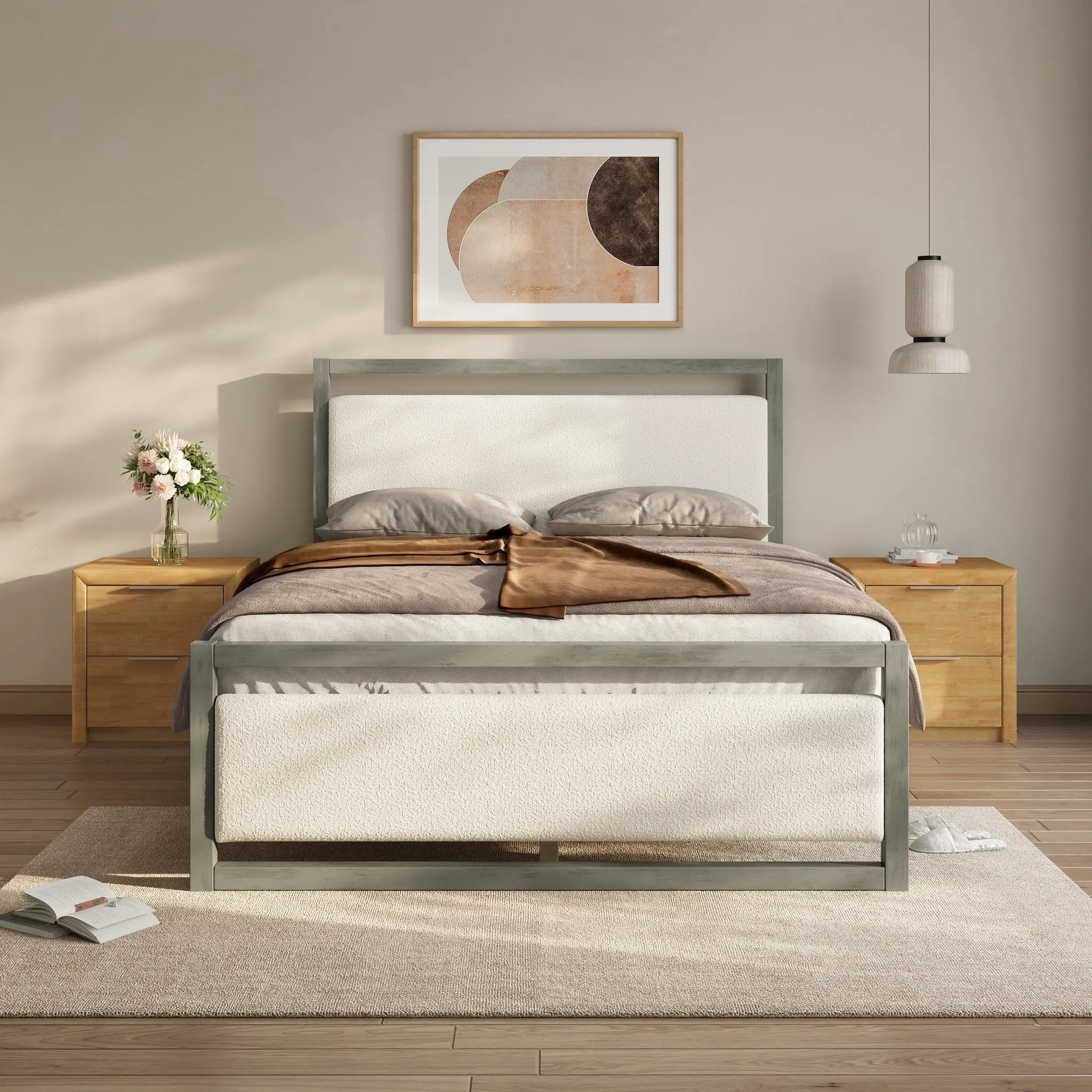 Modern bedroom with a minimalist aesthetic features a bed with white and brown bedding, complemented by a gray bed frame. Flanked by wooden nightstands and illuminated by a pendant light, the room also showcases abstract art on the wall and a rug on the wooden floor.